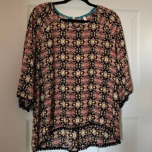XL xhilaration top! 100 % polyester, high low cut at bottom! Black ball trim!